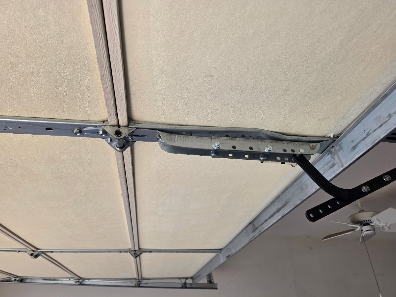 After bent garage door opener bracket repair