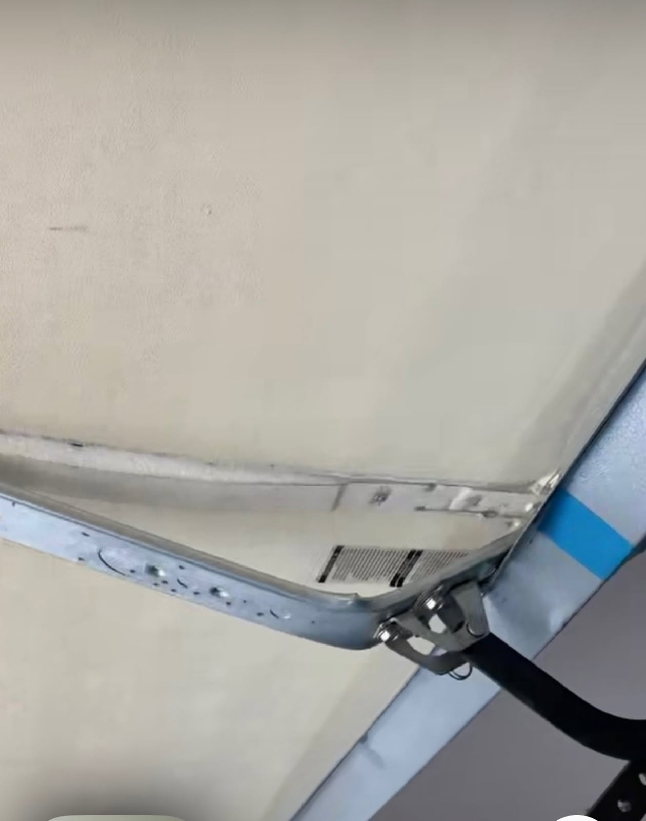 Before bent garage door opener bracket repair